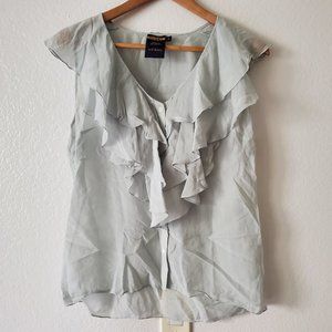 Light blue sleeveless ruffled button down top